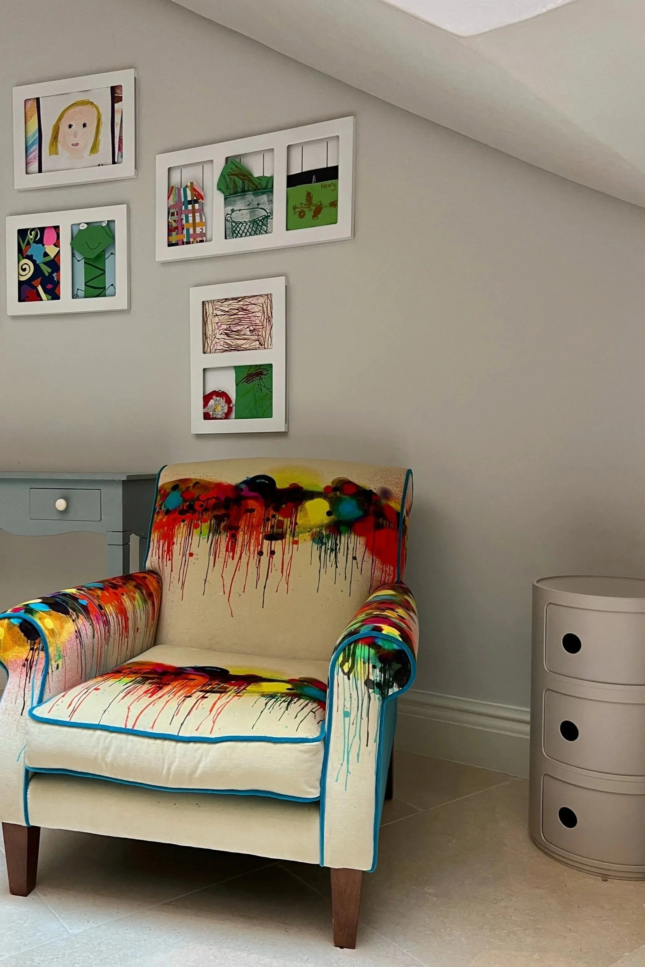  Chair in a fabulous graffiti fabric in the children’s area of a basement renovation. 