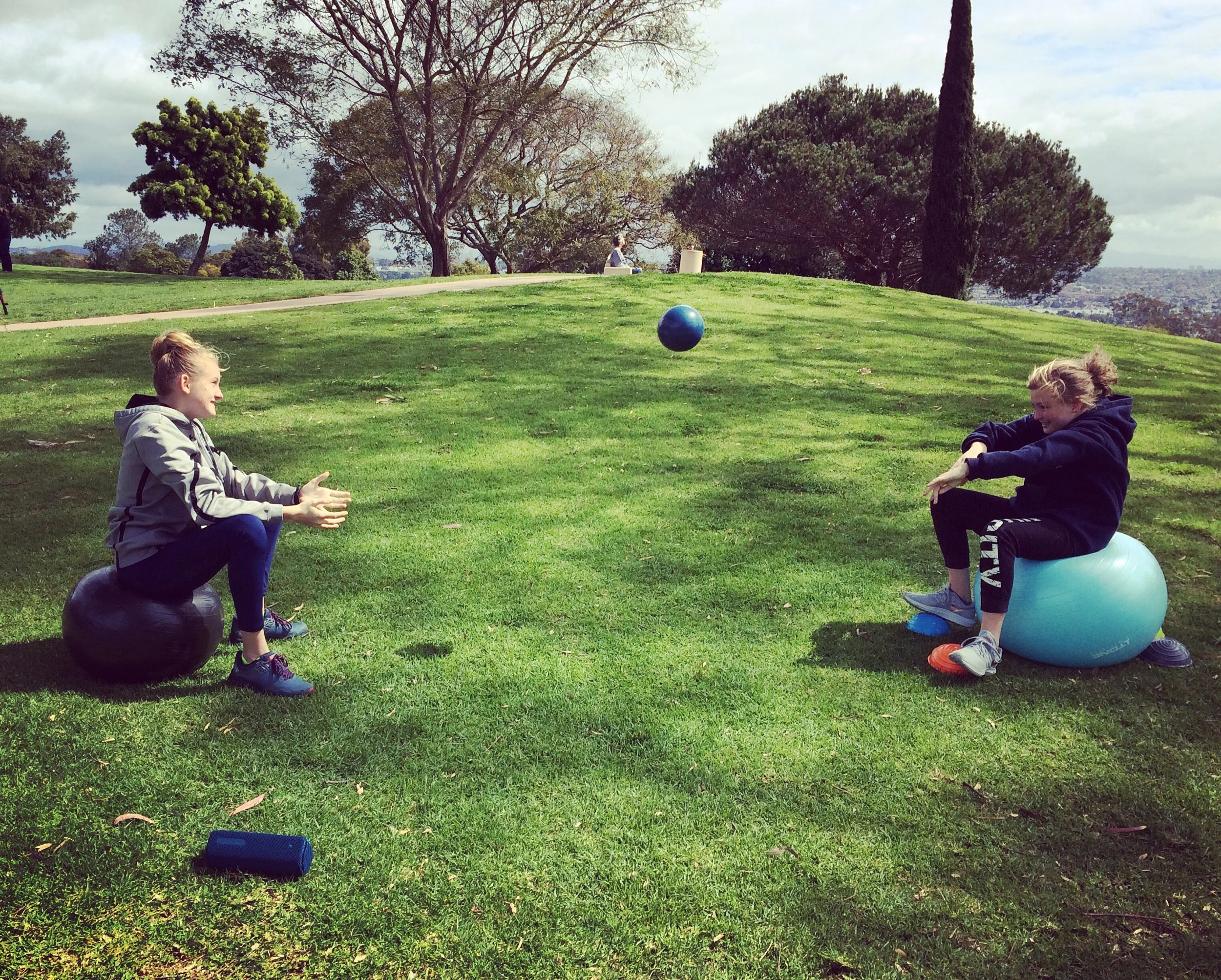 Tween girls laughing at San Diego Fitness class for girls