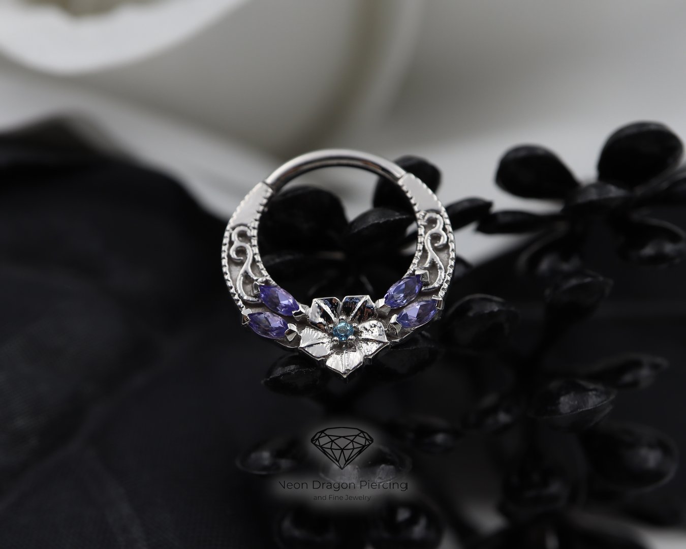 ✨JEWELRY SHOWCASE✨

This stunning ring was a custom order for one of our clients! It is called the Ipomoea from @bvla. The center gem is an Ice Blue Topaz. And the 4 side gems are Tanzanite Marquise. The ring is a 14k White Gold. 

‼STAY TUNED FOR TO