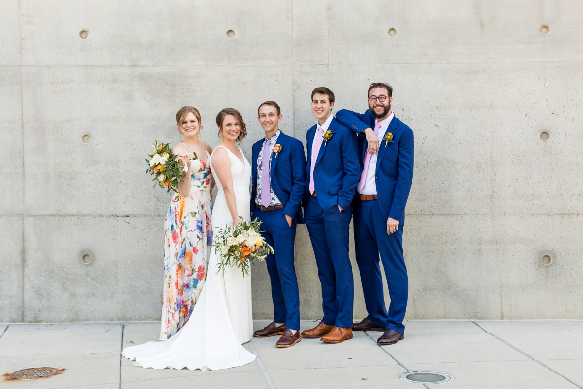 Modern wedding party in floral dresses and blue suits, DC wedding at Arena Stage, Planning by Bella Notte, Photo by Procopio Photography