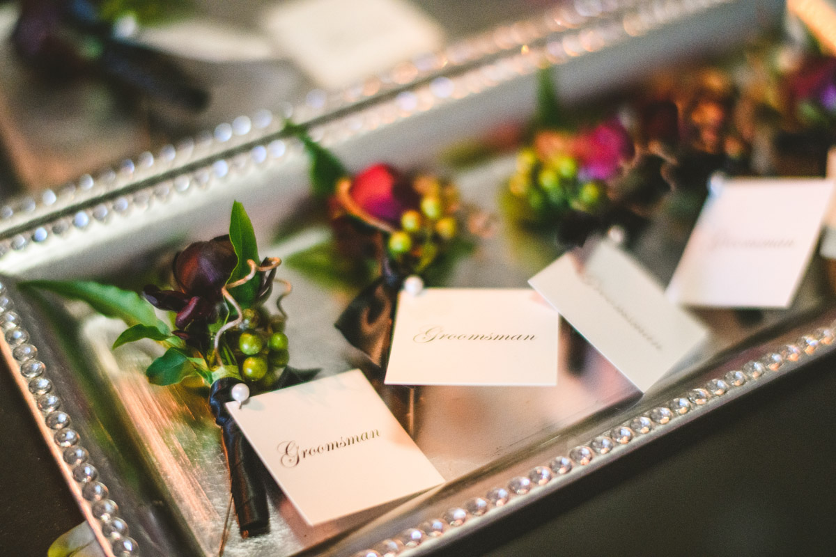 Silver tray of wedding boutonnieres, Wedding planning by Bella Notte, Photo by Sam Hurd