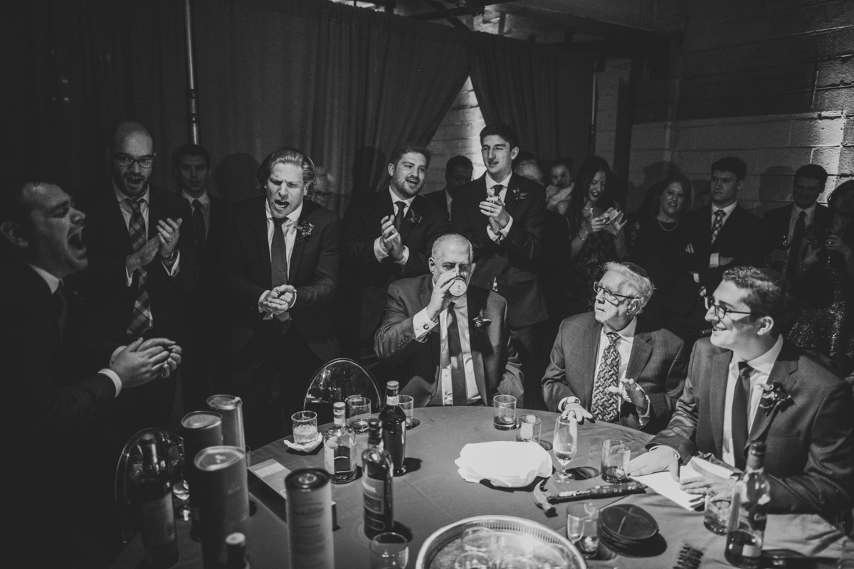 Men during modern Jewish wedding at Dock 5 at Union Market, DC, Planning by Bella Notte, Photo by Sam Hurd