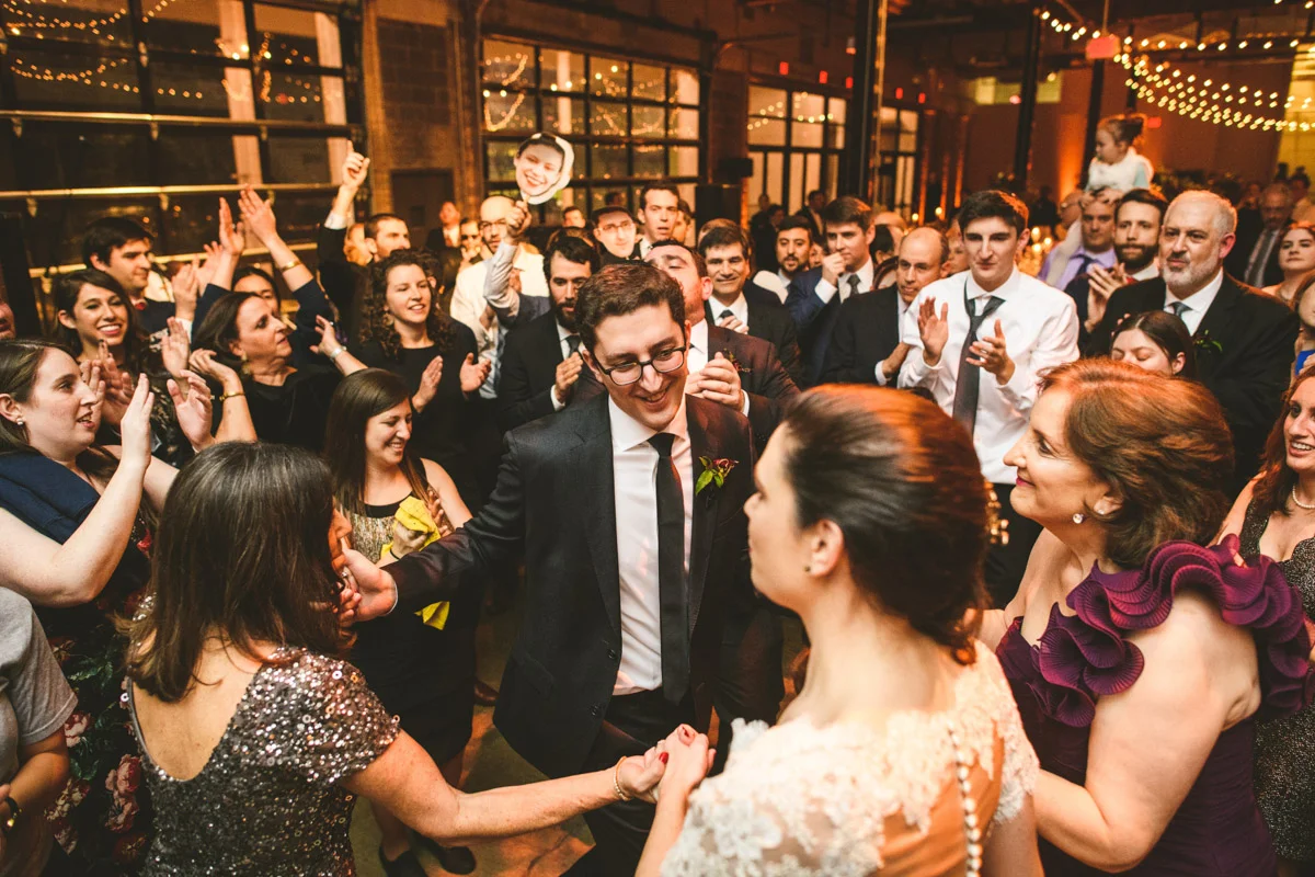 Hora during modern Jewish wedding at Dock 5 at Union Market, DC, Planning by Bella Notte, Photo by Sam Hurd