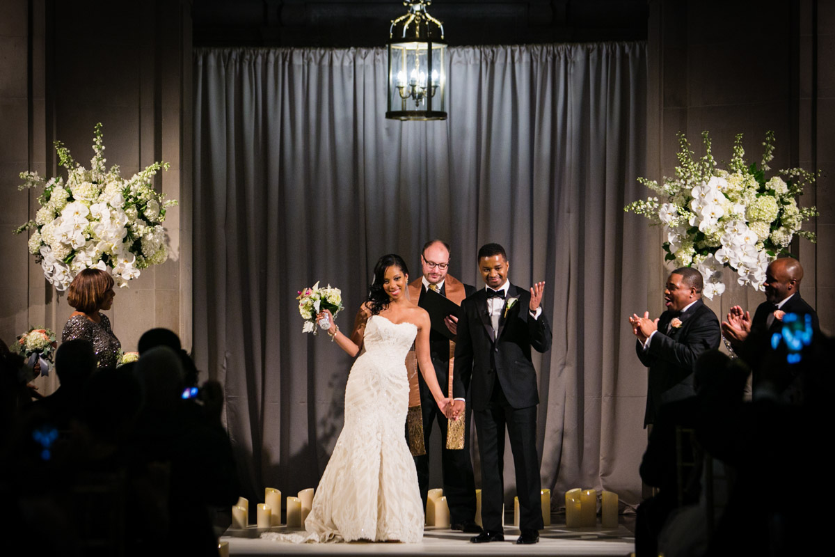 Celebrating during a wedding ceremony at the Mellon Auditorium in DC, Planning by Bella Notte, Photo by The Observatory