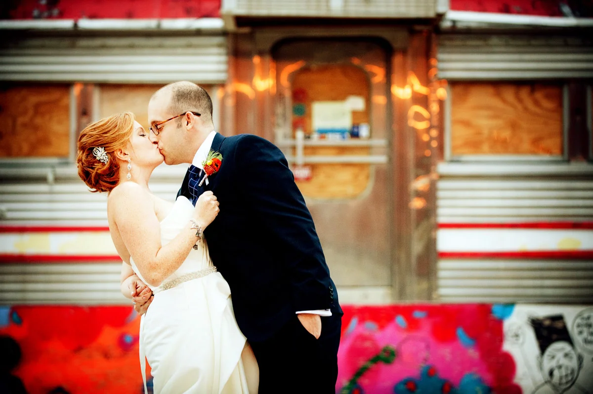 Bride and groom at Dock 5 at Union Market wedding, planning by Bella Notte, Photo by Andrew Harnik