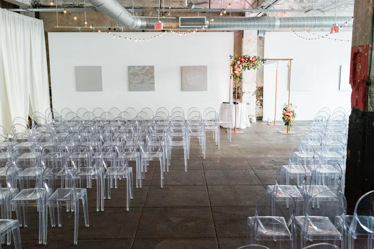 Modern wedding ceremony seating with ghost chairs at Longview Gallery DC wedding, Planning by Bella Notte and Photo by Lisa Boggs Photography