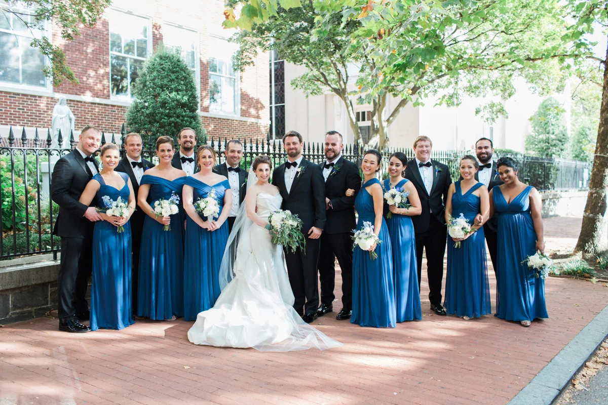 Formal bridal party in royal blue dresses and tuxedos at Washington DC Fairmont Hotel wedding, planning by Bella Notte and photo by Abby Grace Photography