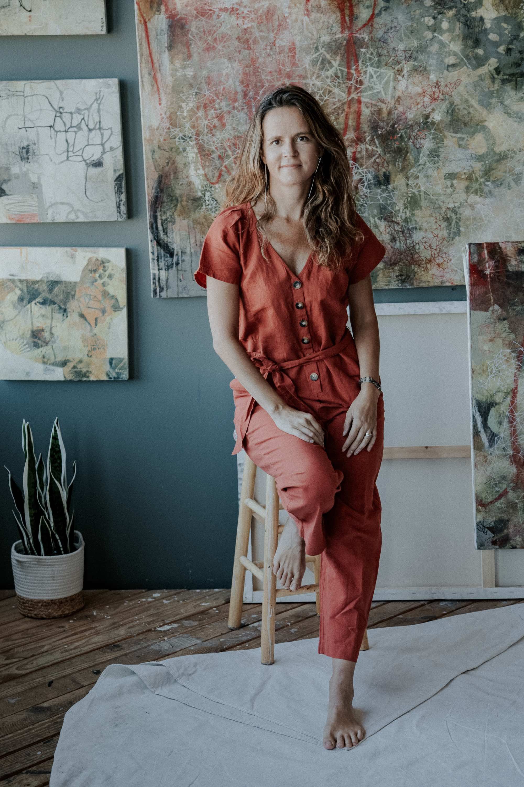 California-artist-Paula-Valenzuela-painting-studio-portrait-in-red.jpg