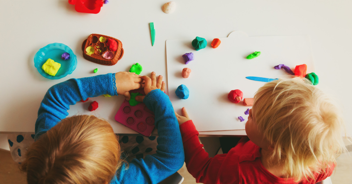 young children playing with playdoh