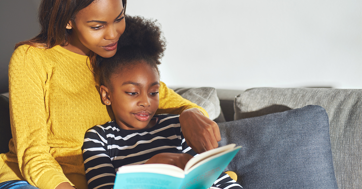 Nanny and child reading a book