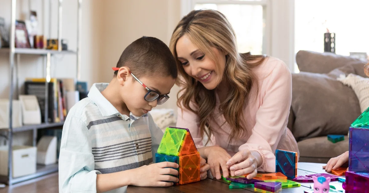 Windy City Nanny and child playing with educational toys