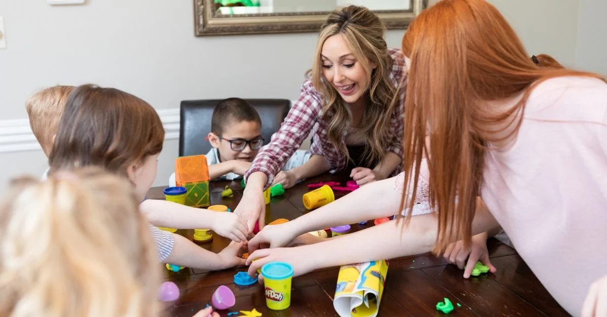 Windy City Nanny and kids playing with play-doh