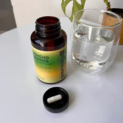 purewell sciences psychobiotics bottle with lid off and capsule