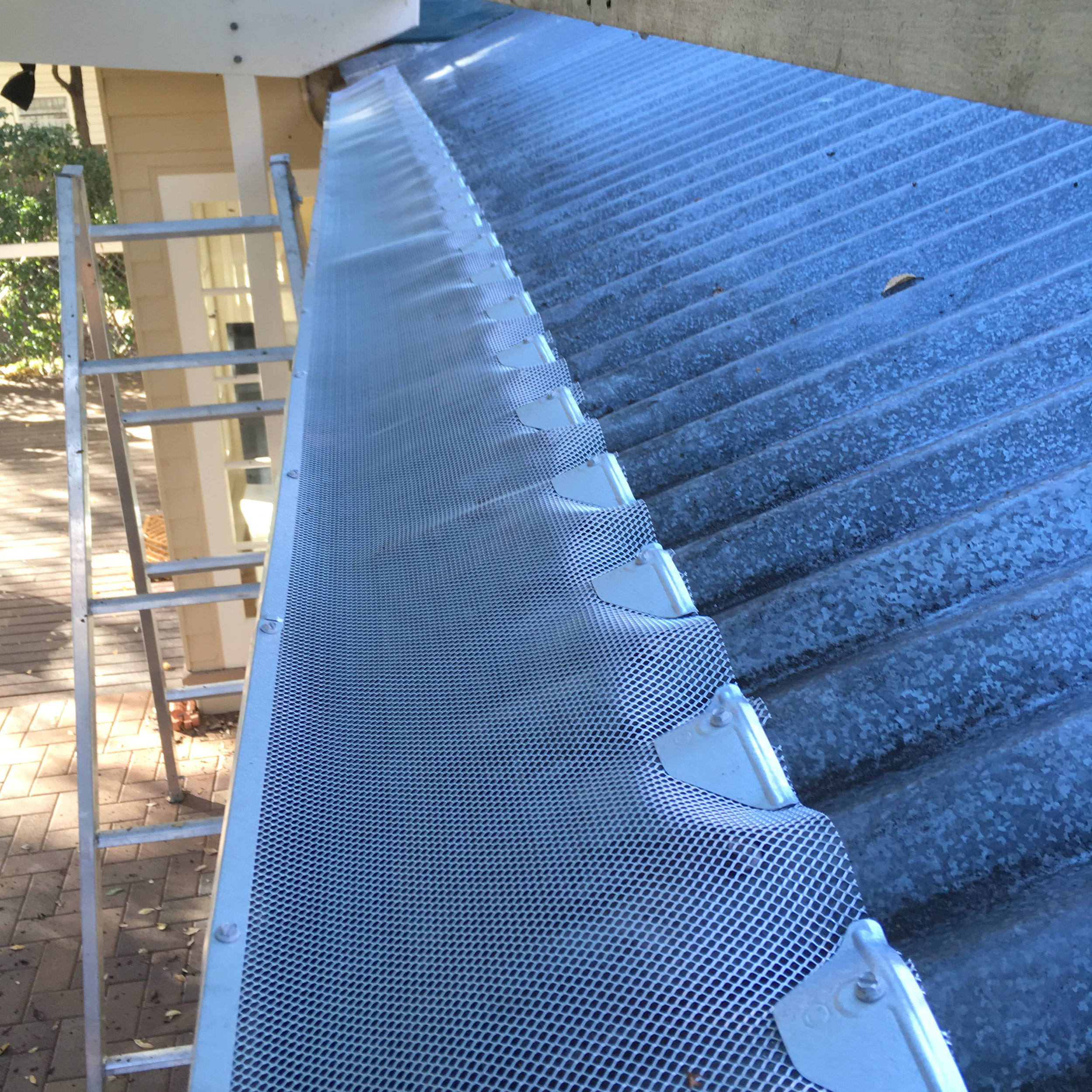 Gutter guard installation and roof cleaning