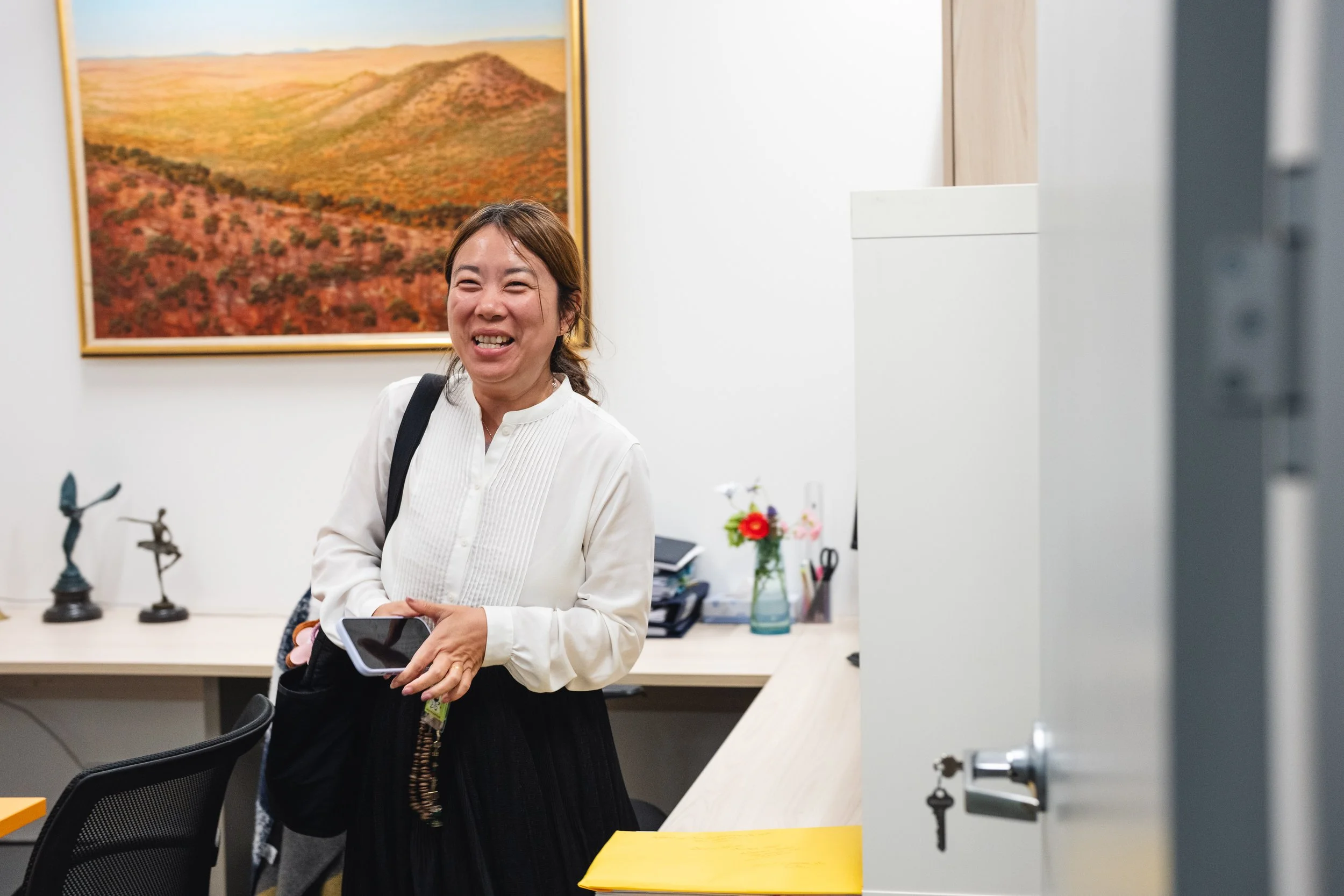 IY smiling in office.jpg