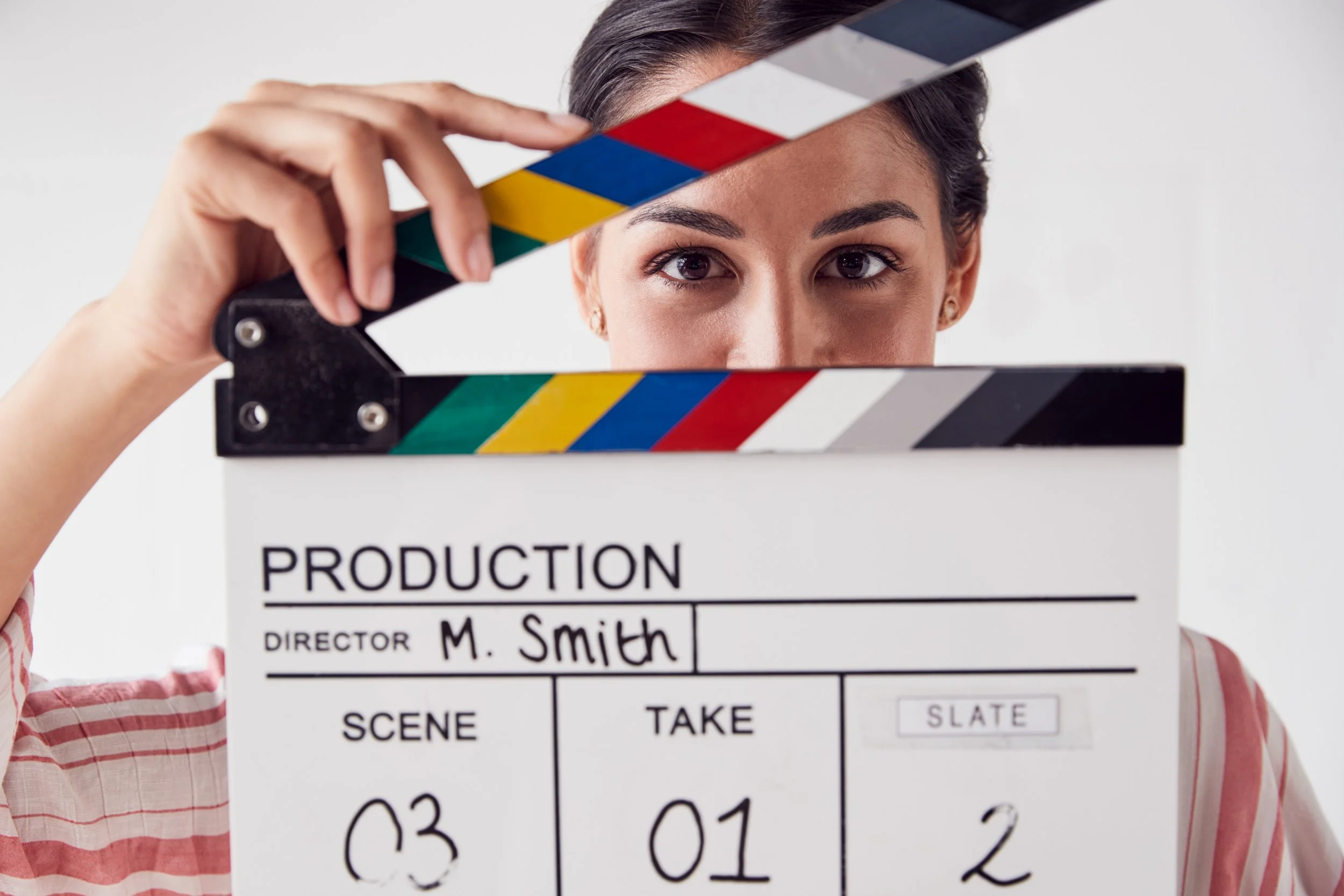 portrait-of-female-videographer-holding-clapper-bo-2021-08-26-16-14-46-utc.jpg