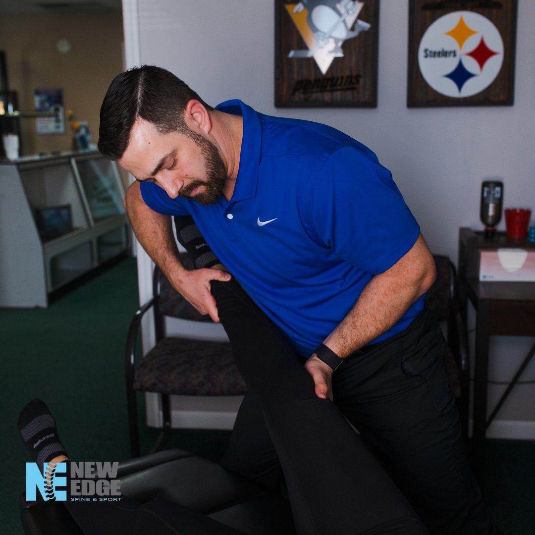 Dr. Ben Hosler performing a rehabilitation assessment at New Edge Spine and Sport in Pittsburgh