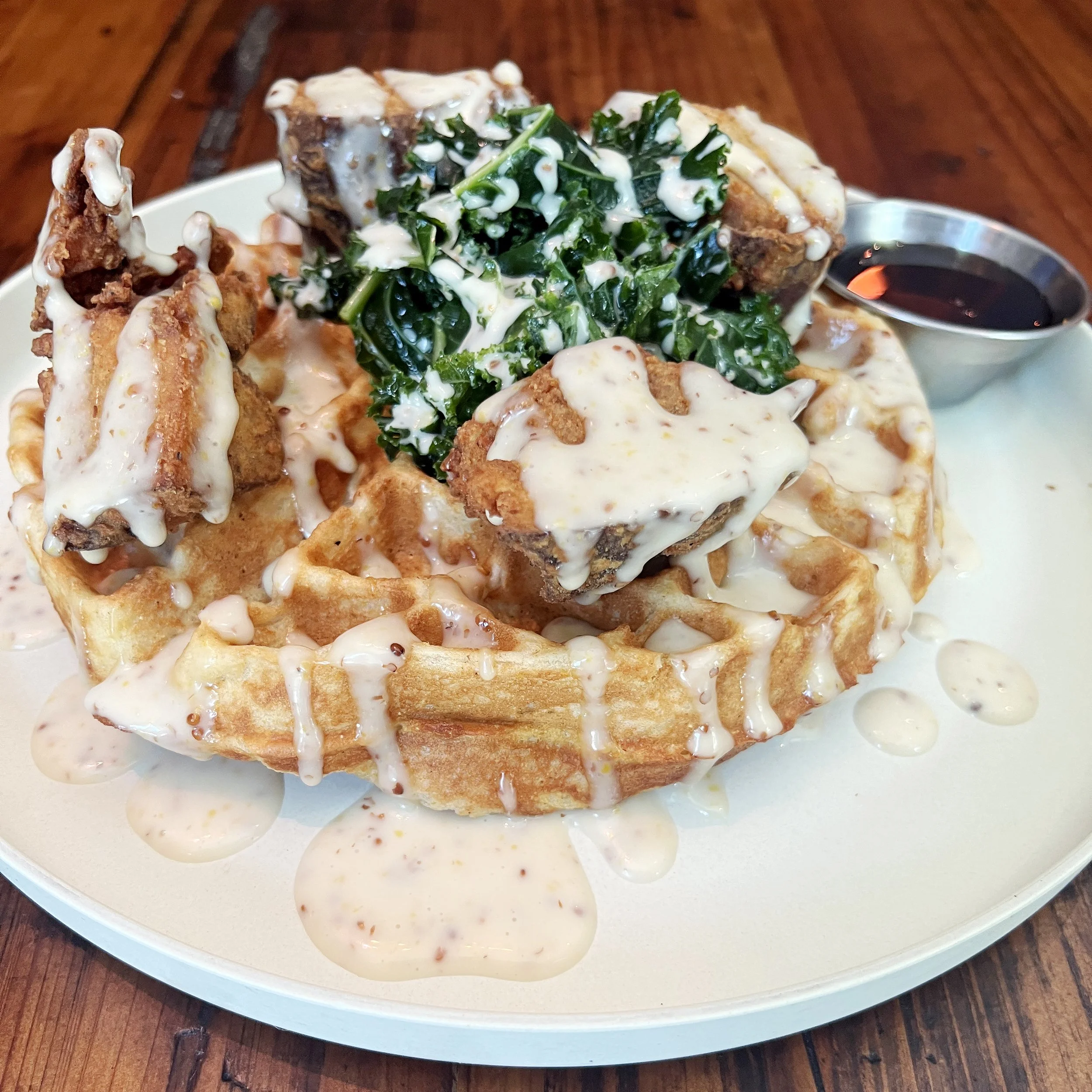 Urban Vegan Kitchen’s vegan Chick-un & Waffles with southern fried seitan, waffles, maple mustard aioli, and maple syrup
