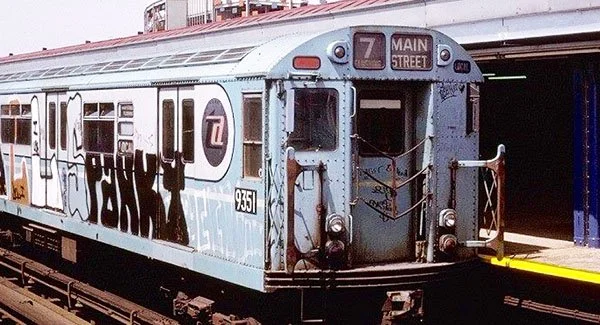 Vintage 7 train subway car at a Queens station, recalling teenage rides into downtown New York City.