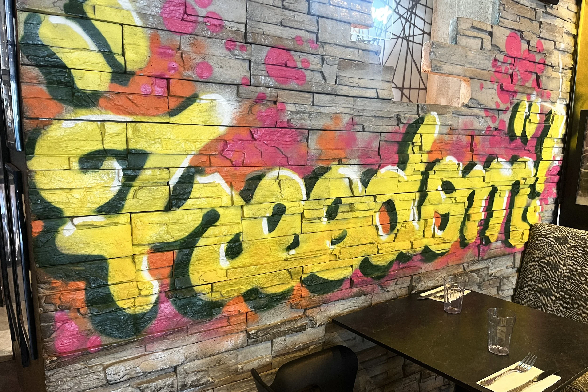 Colorful “Freedom” graffiti mural inside Urban Vegan Kitchen in Chelsea, NYC.