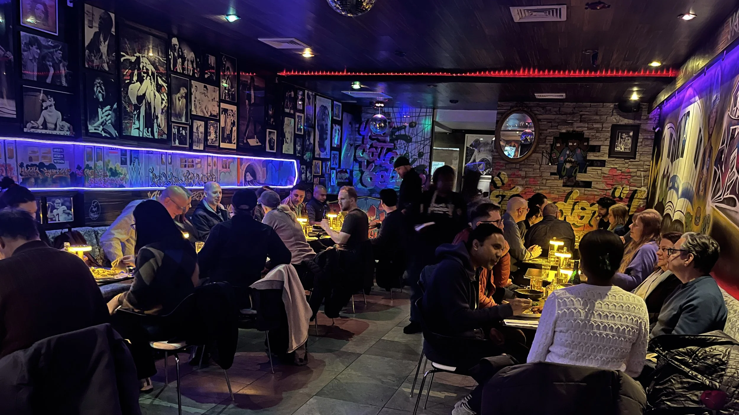 Guests dining inside Urban Vegan Kitchen, a vegan restaurant in Chelsea, NYC
