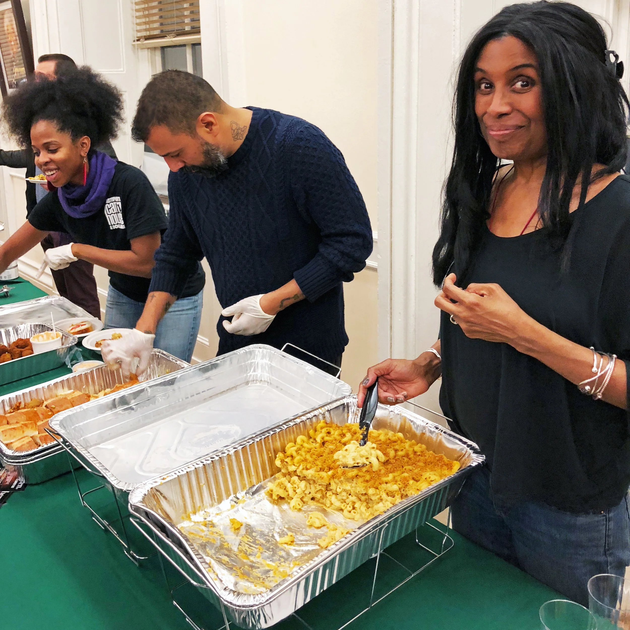 Pamela serving Urban Vegan Kitchen food at a vegan food event in New York City.