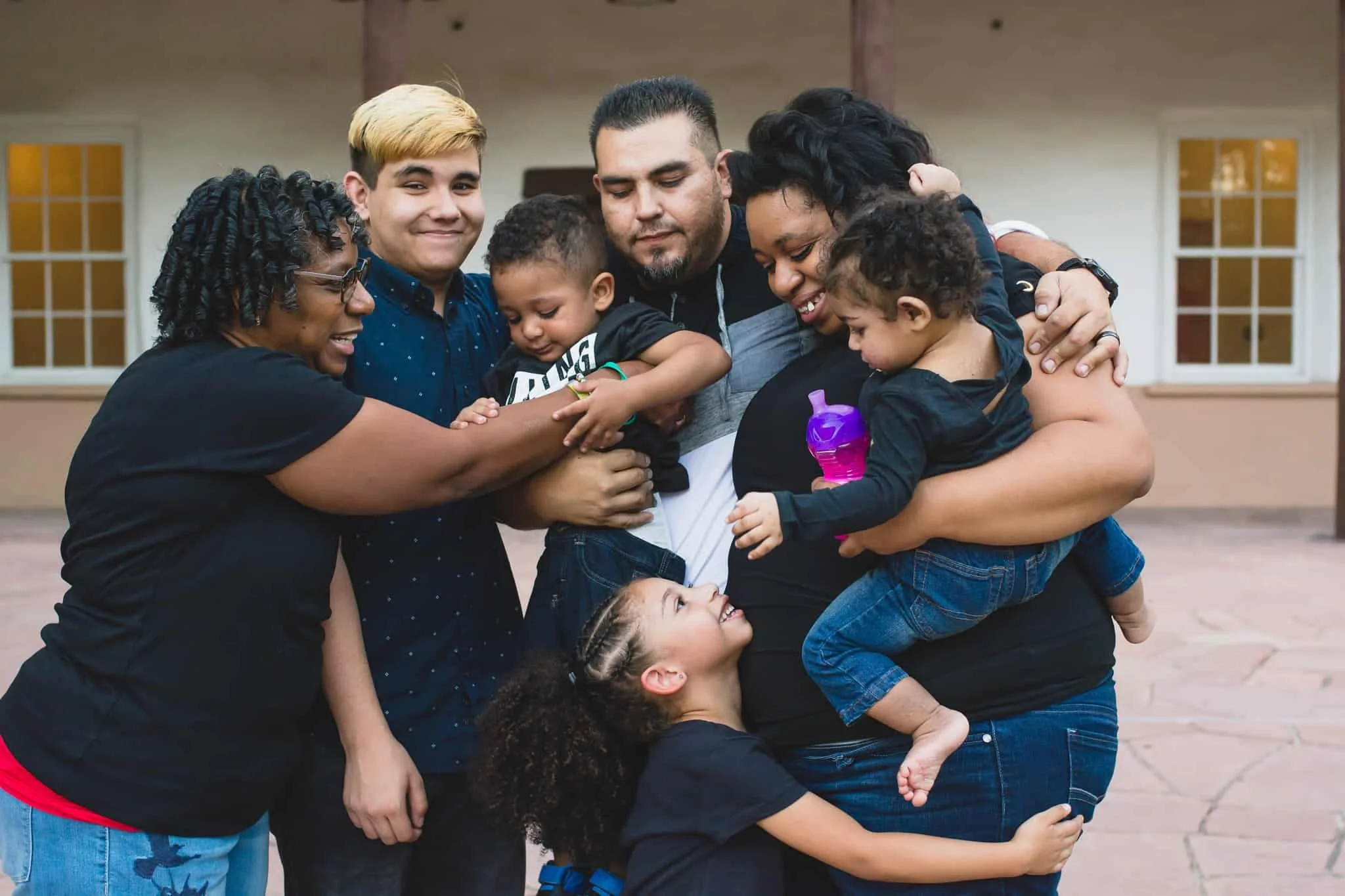 Family all standing together and hugging