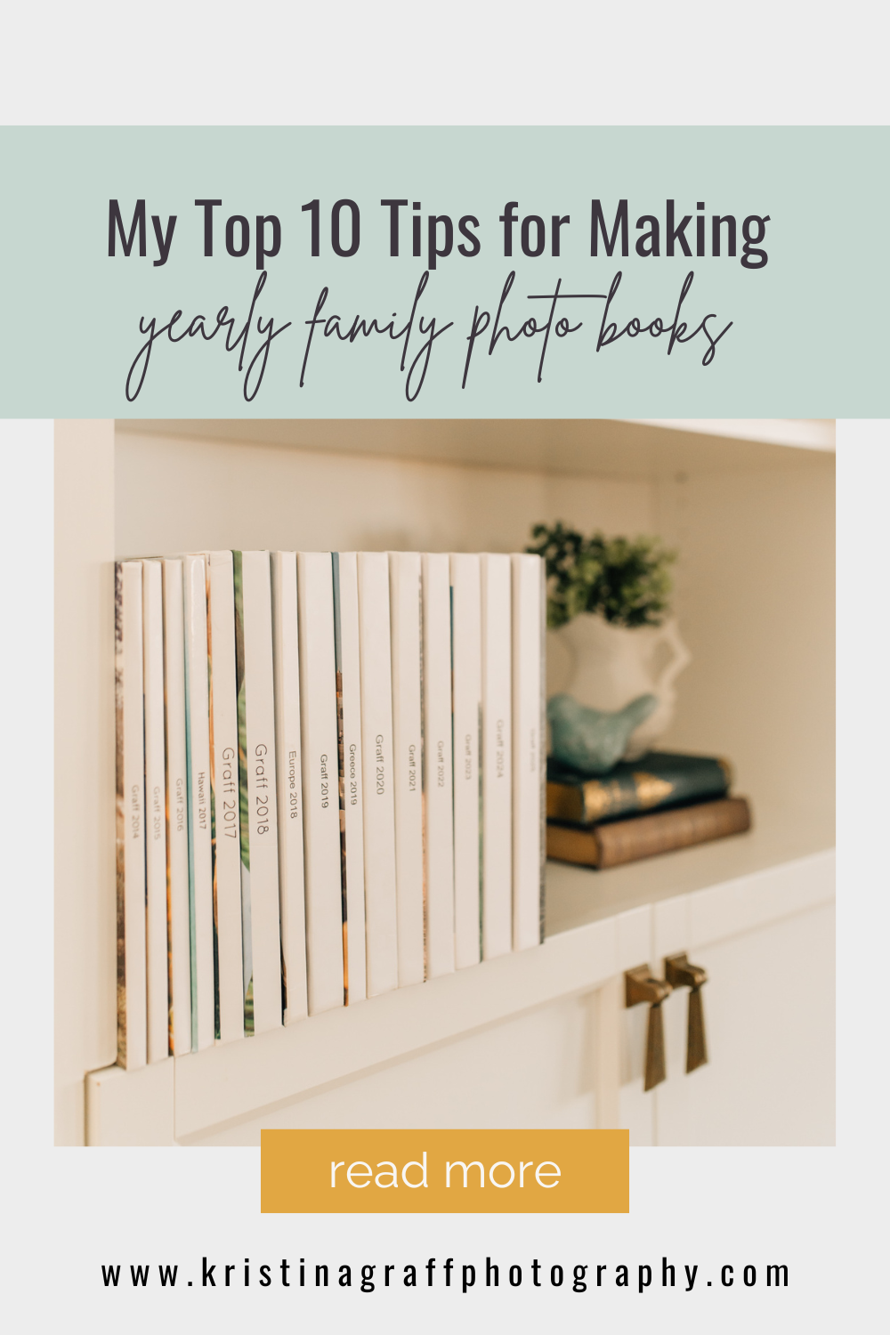 books with white spine and the year lined up in a white bookcase with decorations to the side. text overlay reads "my top 10 tips for making yearly family photo books"