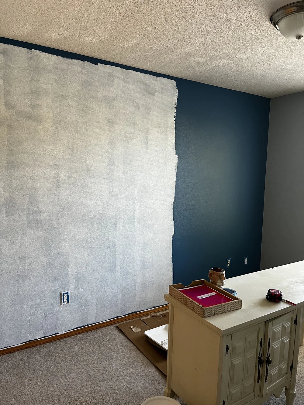 Painting the blue walls in the office white