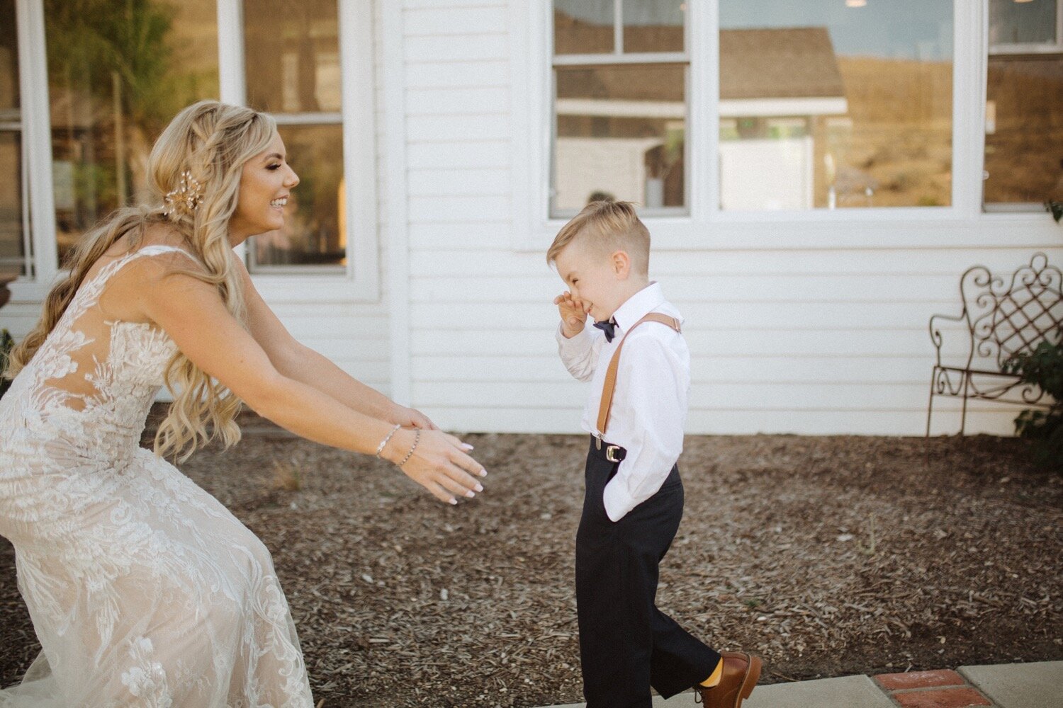 bride does a first look with her son before her higuera ranch wedding. poppy and vine photography