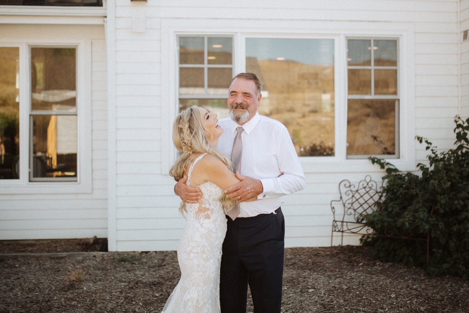bride and father share an intimate moment during their first look at her higuera ranch wedding in san luis obispo. paso robles wedding photographer