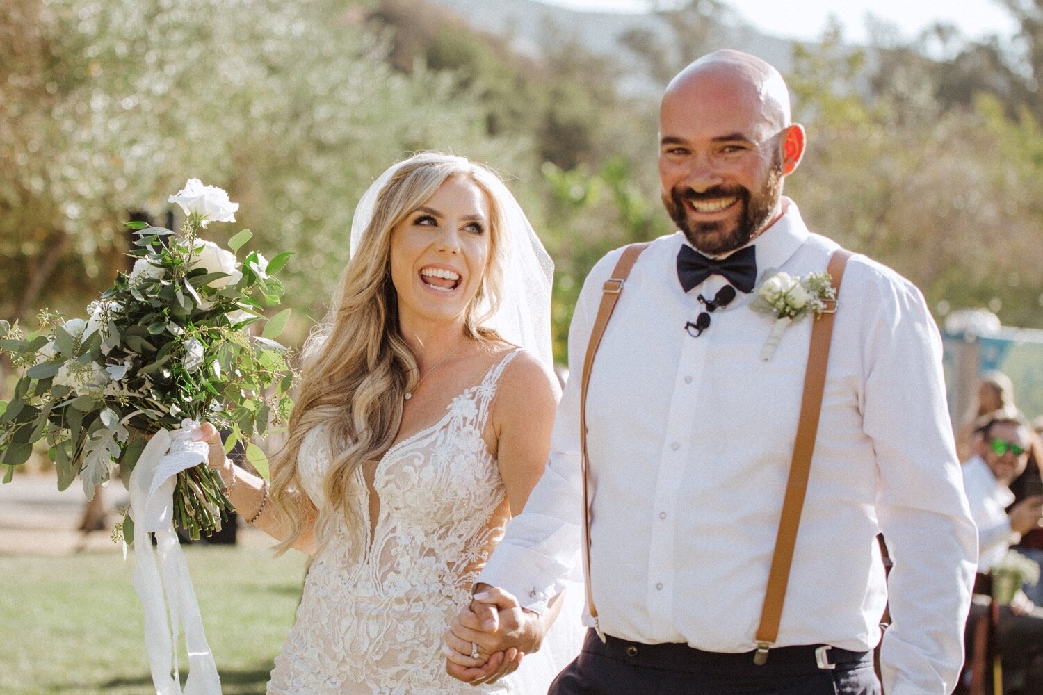 bride and groom excited after their wedding ceremony at higuera ranch. wedding photographers in san luis obispo
