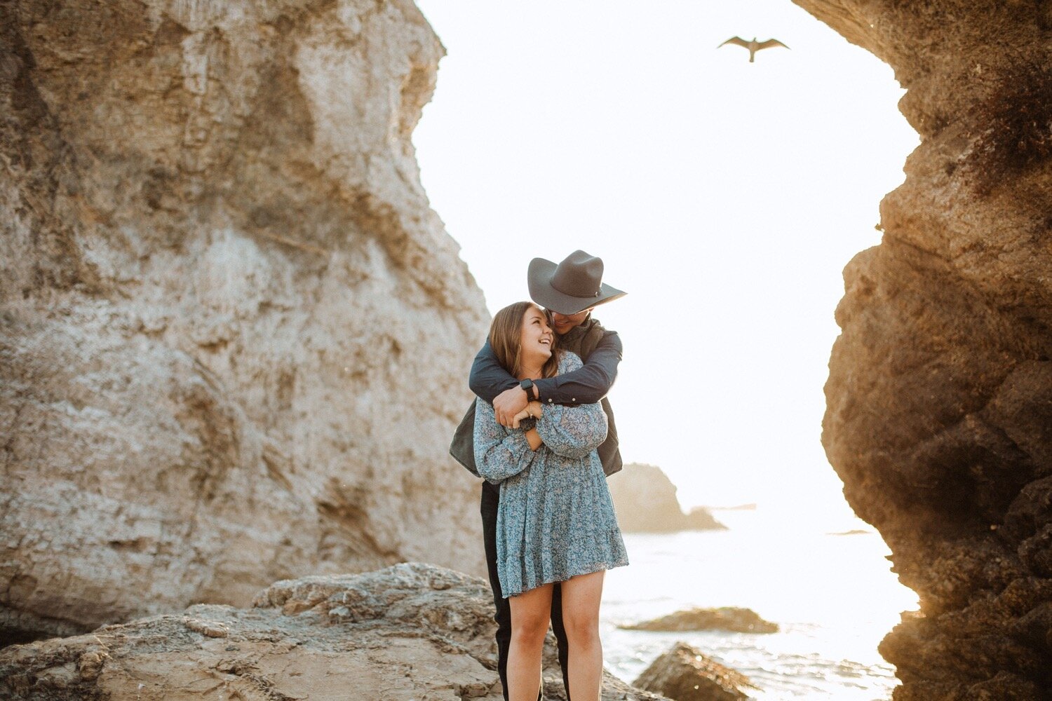  couple embraces one another during their pismo beach anniversary session couples photoshoot. wedding photographer san luis obispo poppy and vine 