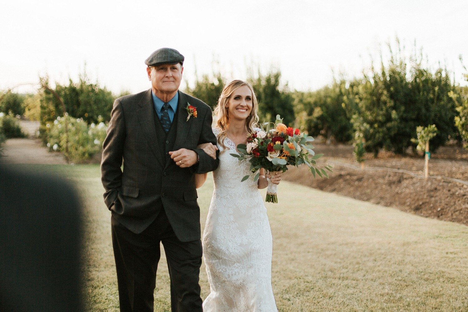  the bride and her dapper father walk down the aisle at her dana powers house wedding in nipomo, captured by central coast wedding photographer poppy and vine 