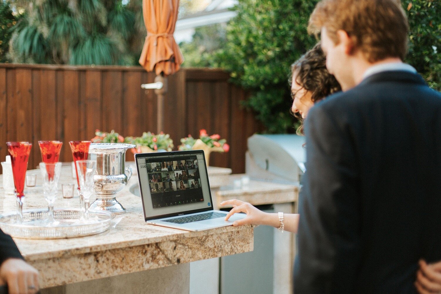  a common sight at a Coronavirus elopement in 2020, the bride and groom say hello to family and friends tuning into their wedding ceremony via Zoom live stream. Lilia &amp; Jack were married in Jack’s parents’ backyard in Los Angeles, and their weddi