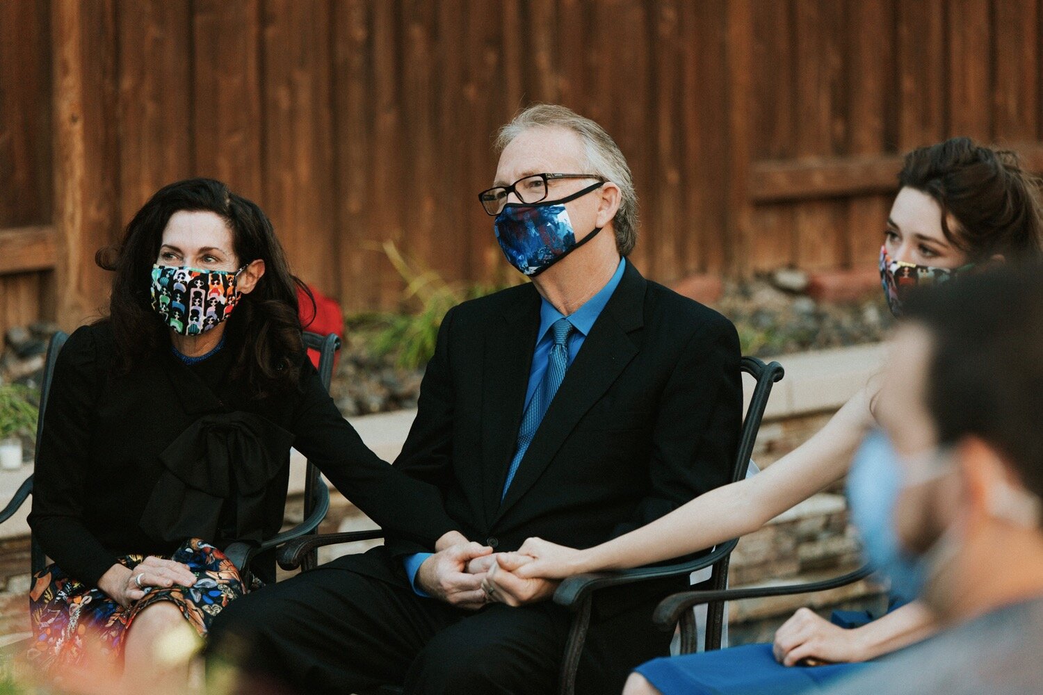  family members, wearing masks due to the coronavirus pandemic, watch as their son is married in an intimate wedding ceremony in westlake village, near los angeles. san luis obispo wedding photography duo poppy and vine was there to capture the elope