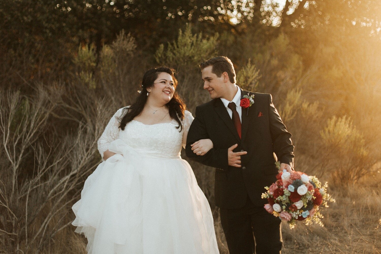  bride and groom excitedly walk arm in arm after getting married in an intimate nipomo wedding, captured by slo wedding photography duo poppy and vine 