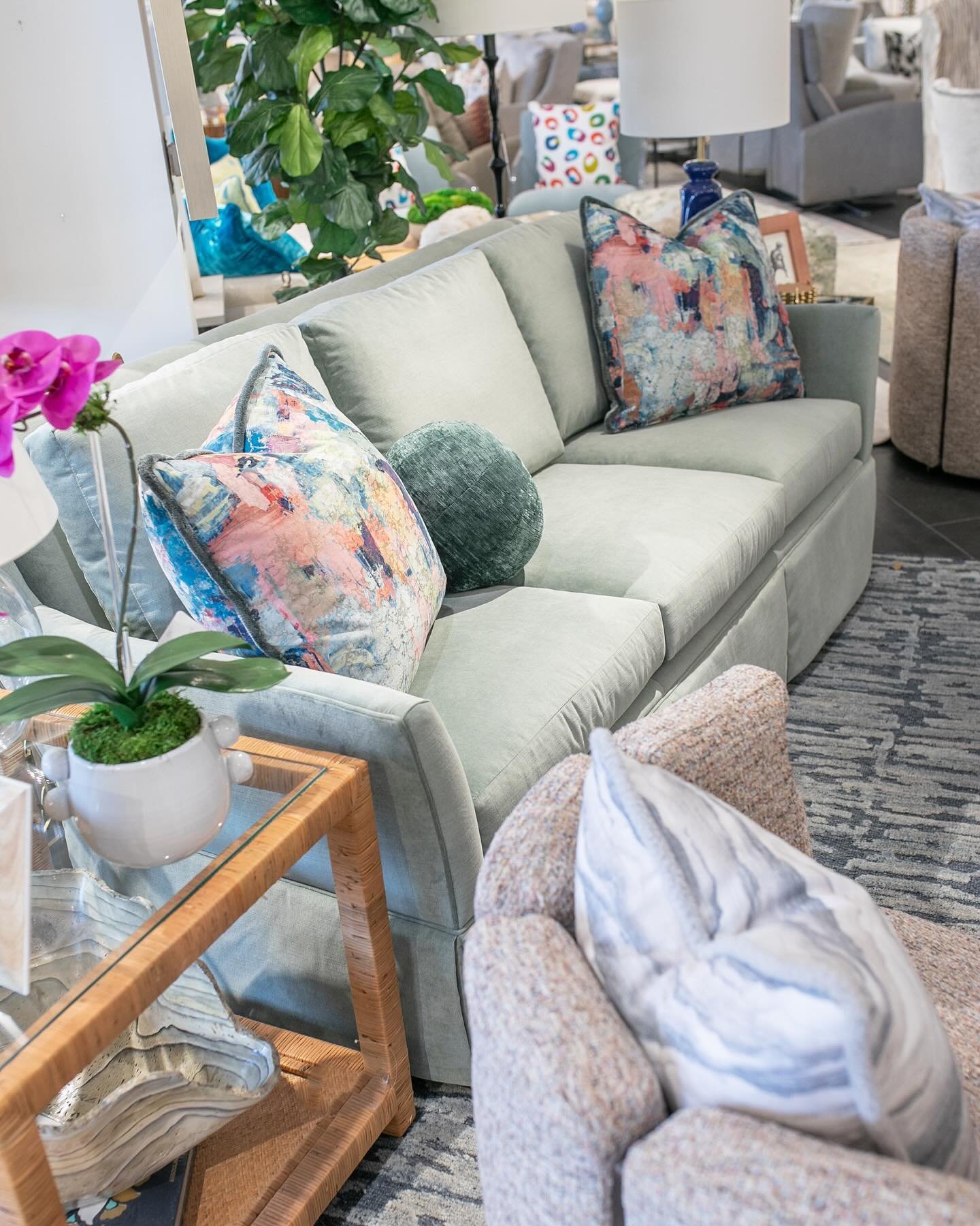 Soothing greens were all over @hpmkt this spring! A vibrant work of art and coordinating throw pillows full of saturated hues ignite the subtle shade of the sofa and bring it to life✨ Is this a trend you&rsquo;ll hop on? 

🚚 We deliver to the OKC me