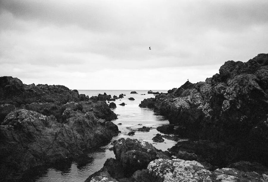Ilford HP5 Plus - Around the Bays - View out to Sea through the Rocks.jpg