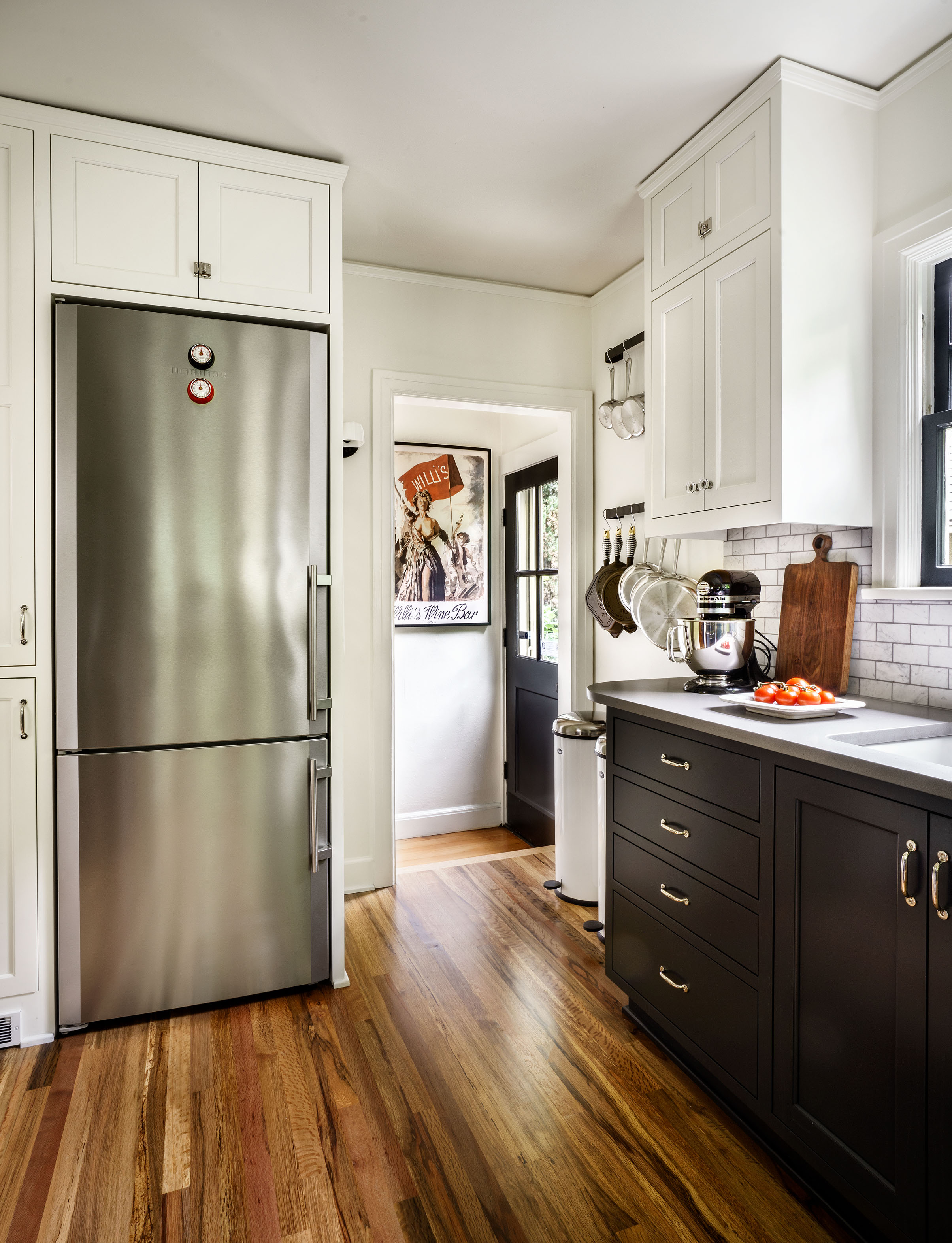 Freestanding fridge integrates into the cabinetry.