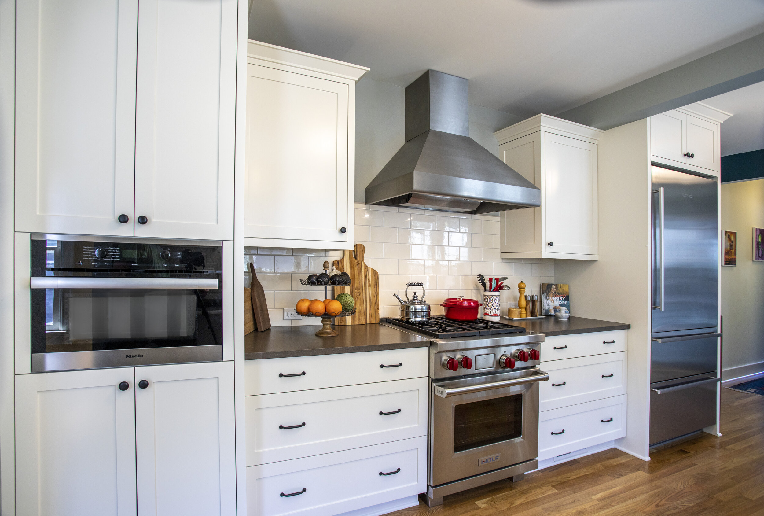 Existing stove and hood were retained and complimented with new cabinets and appliances.