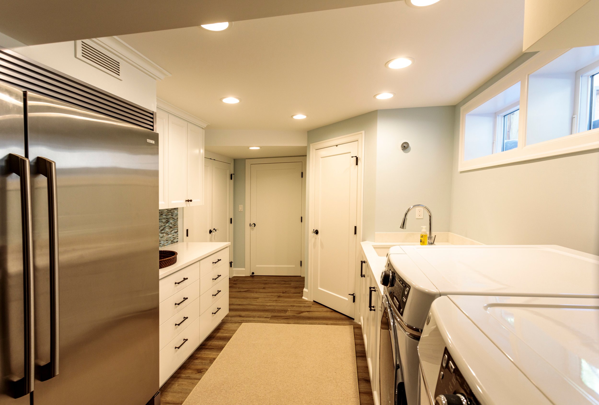 Basement: Large laundry room contains a full sized refrigerator and freezer along with a large closet for auxiliary pantry storage.