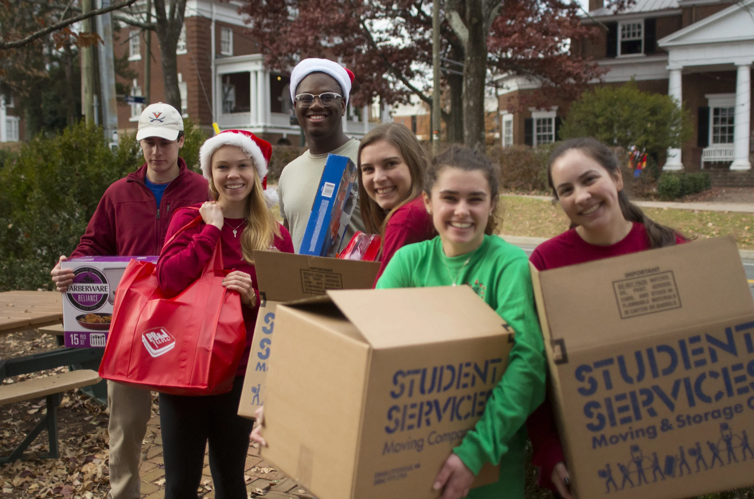 Holiday Sharing volunteers help delivery boxes of donated goods to families in need during the holidays.jpg