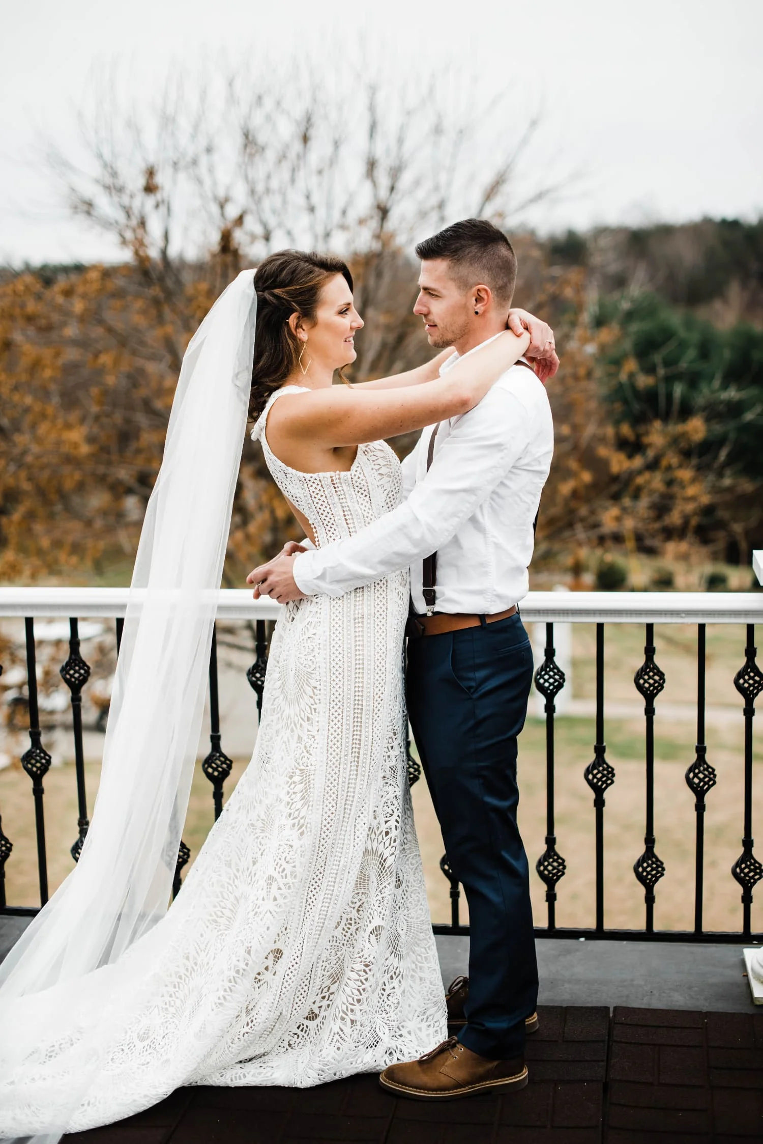 bride and groom on balcony at Belle Garden Estate.jpg