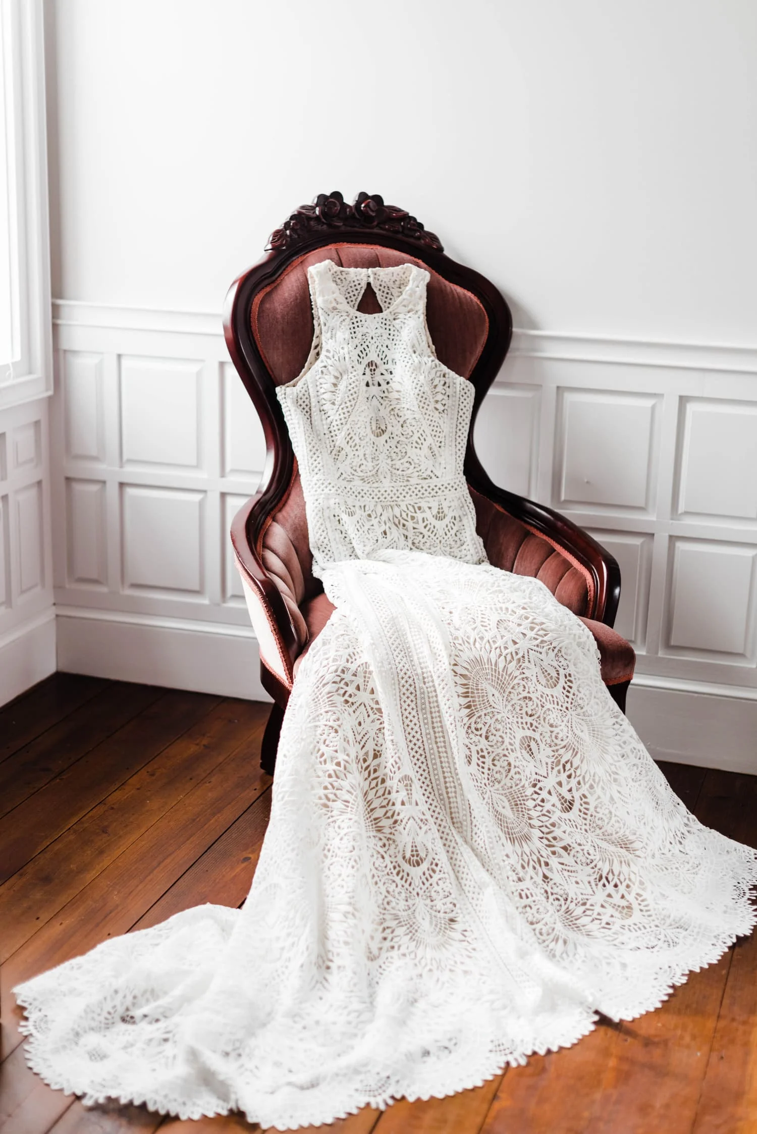 Bride's dress on chair at historic bed and breakfast.jpg