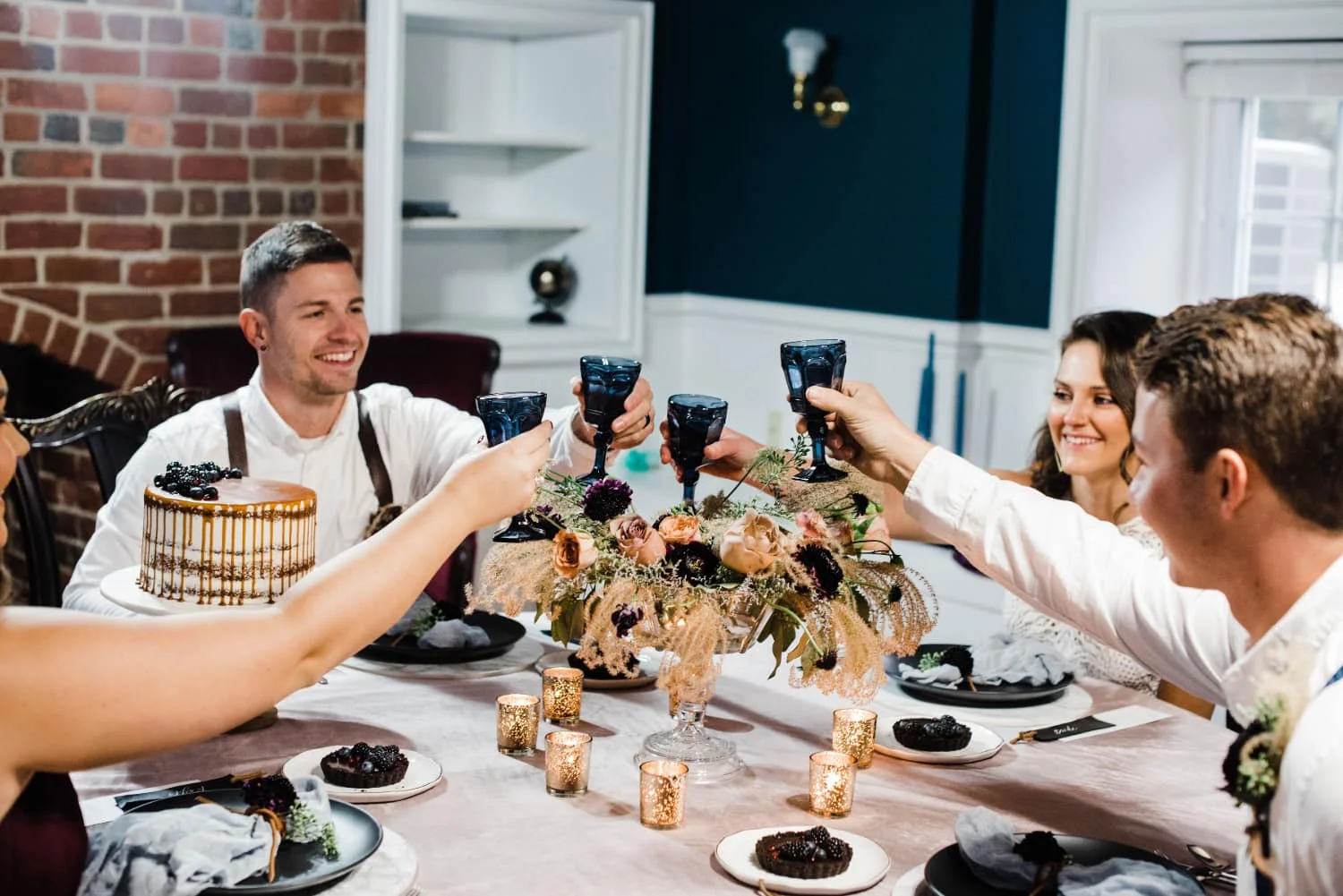wedding party toasting at the dinner table.jpg