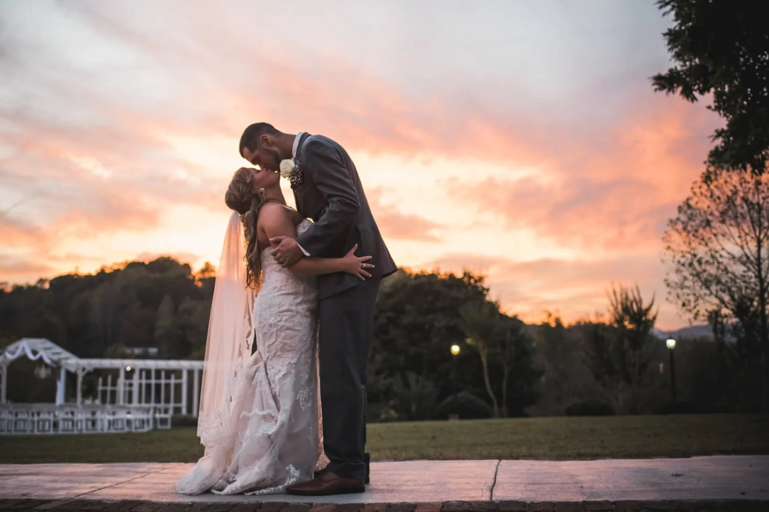 bride and groom at sunset Belle Garden