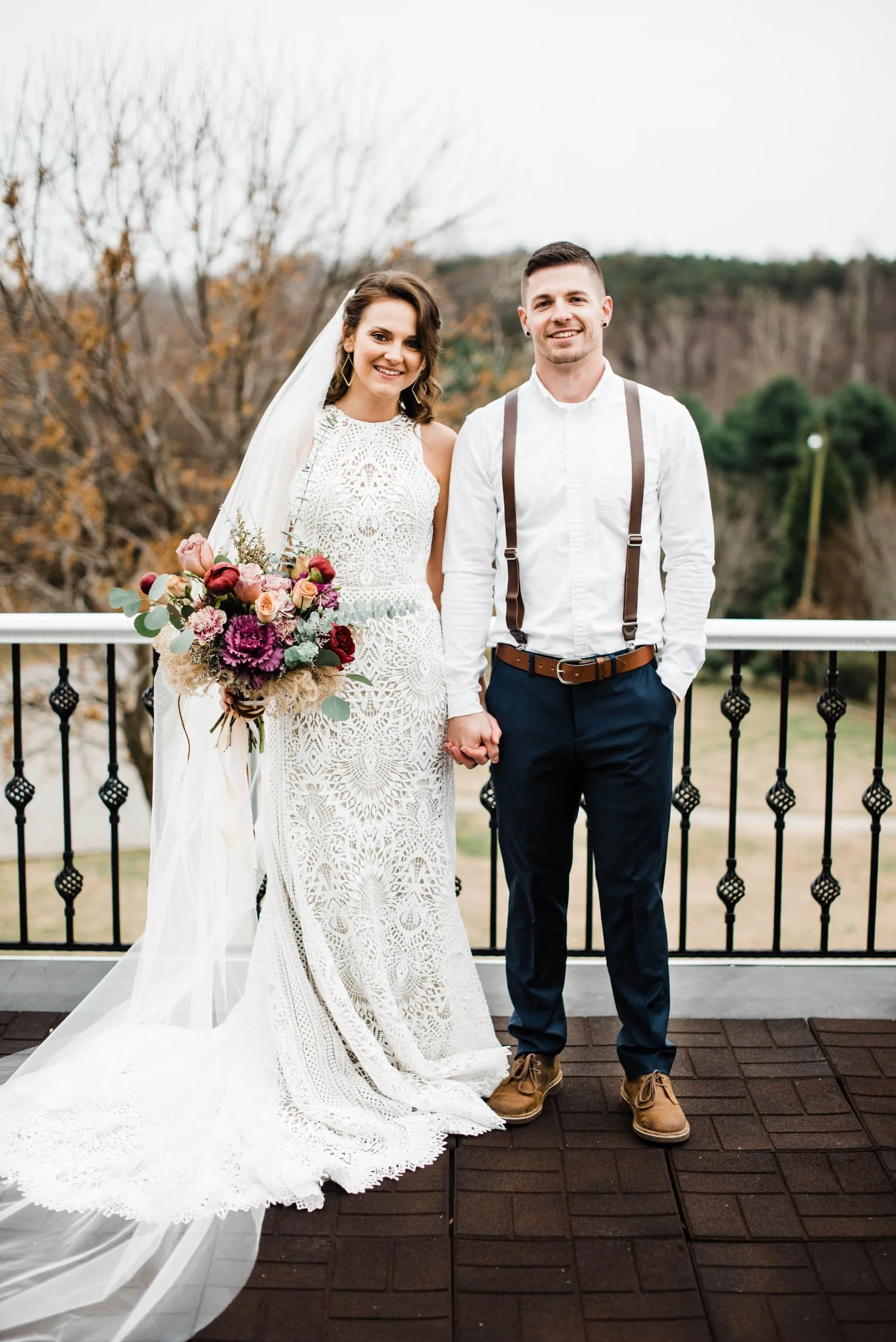 bride and groom posed on balcony.jpg