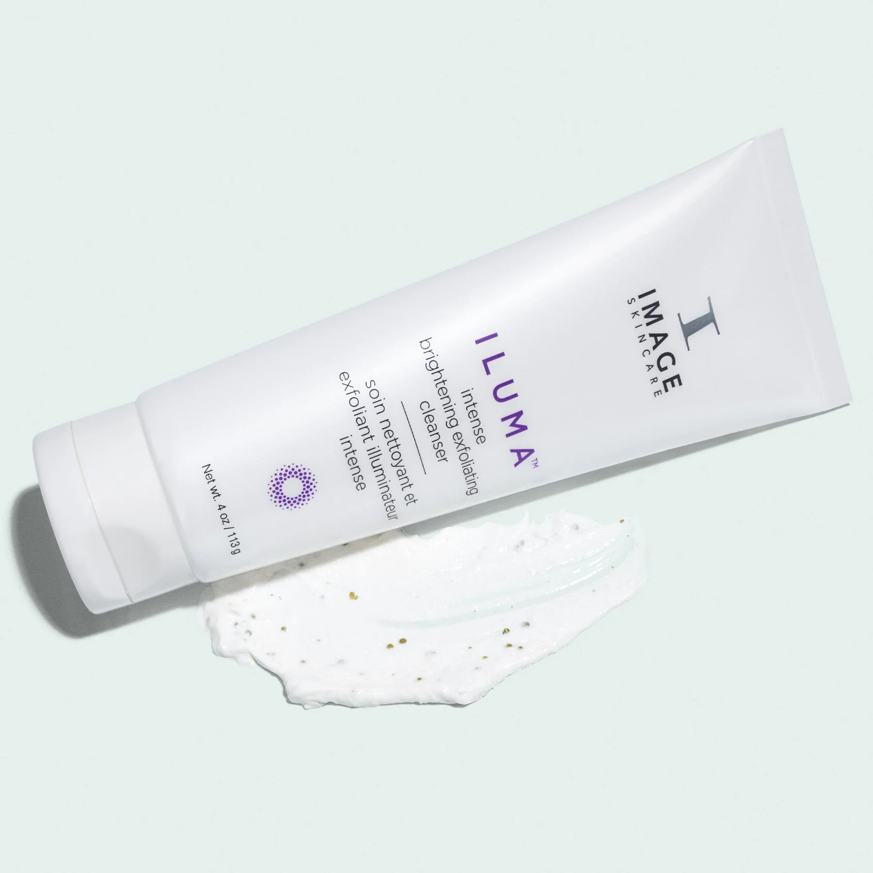 ILUMA intense brightening exfoliating cleanser. Luxurious cream-to-foam cleanser with mushroom enzyme, bamboo spheres, and natural extracts. Brightens, refines, hydrates for radiant skin.