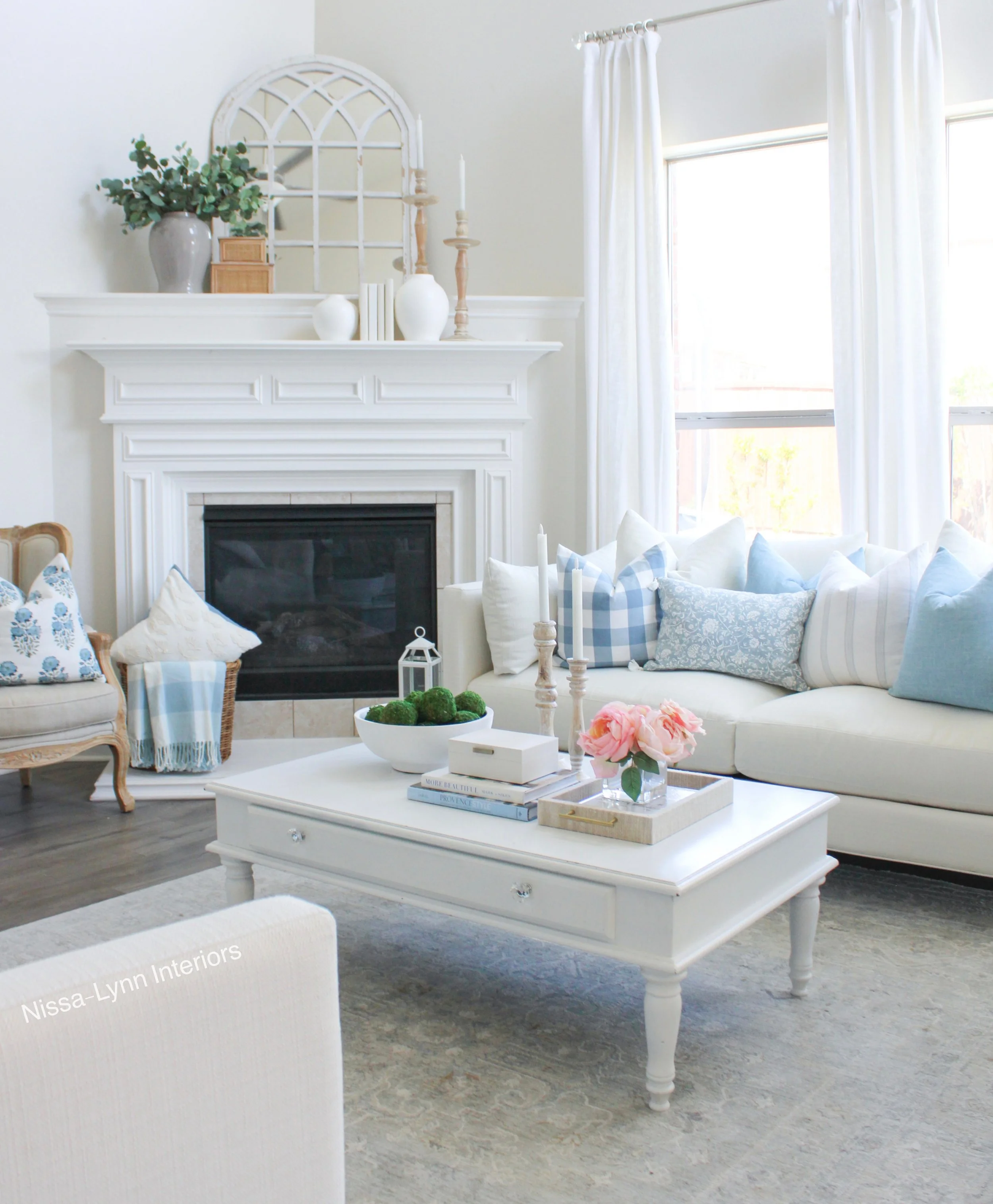 white living room with corner fireplace
